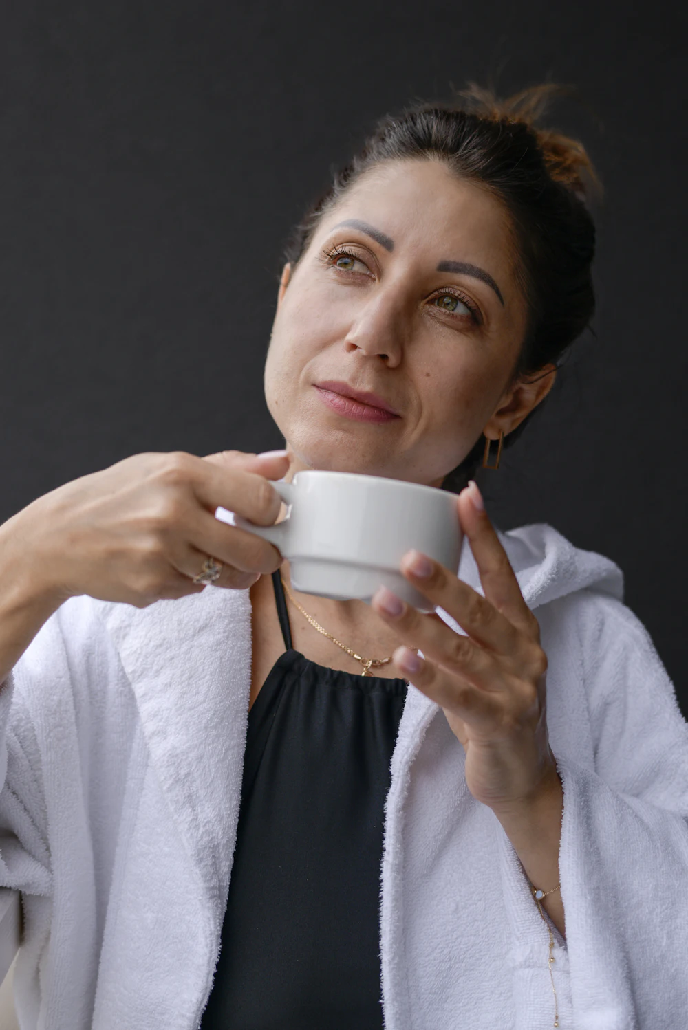 A calm woman with a cup of tea